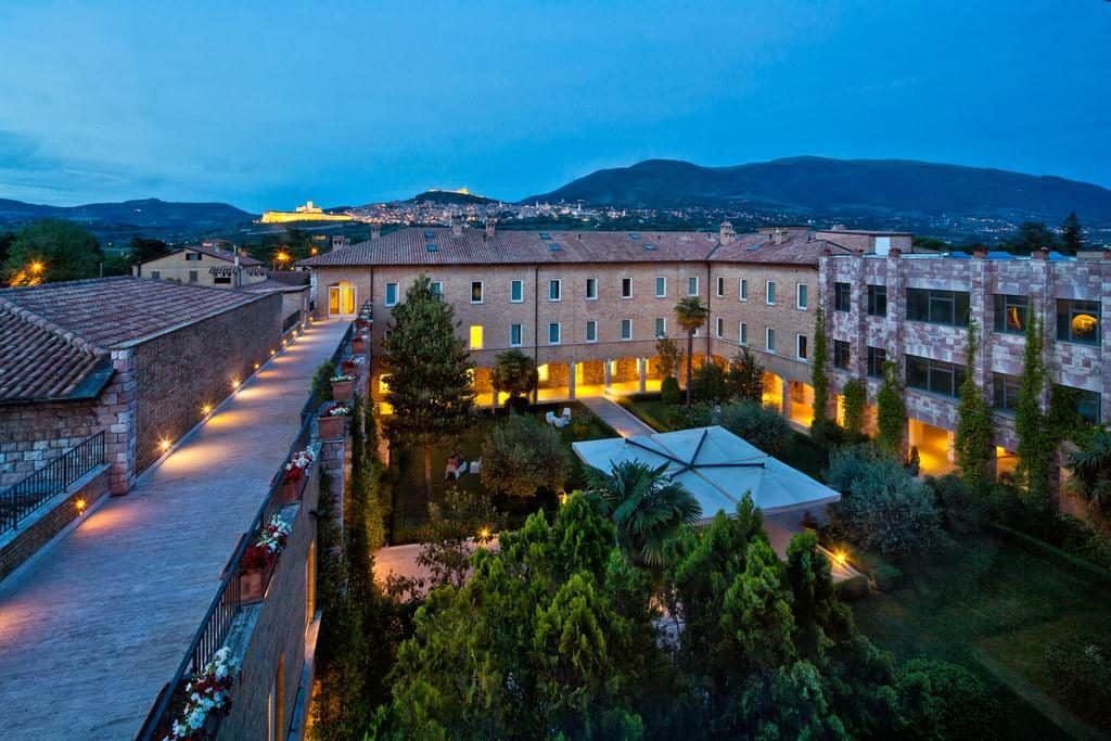 Cenacolo hotel Assisi, Italy, view of the hotel and courtyard trees from above in the evening