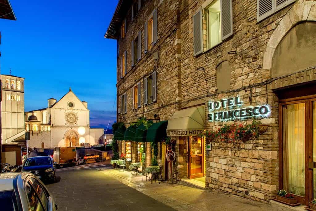 hotel san francesco, Assisi, Italy, view of the building and the entrance from the outside, street, cars, church