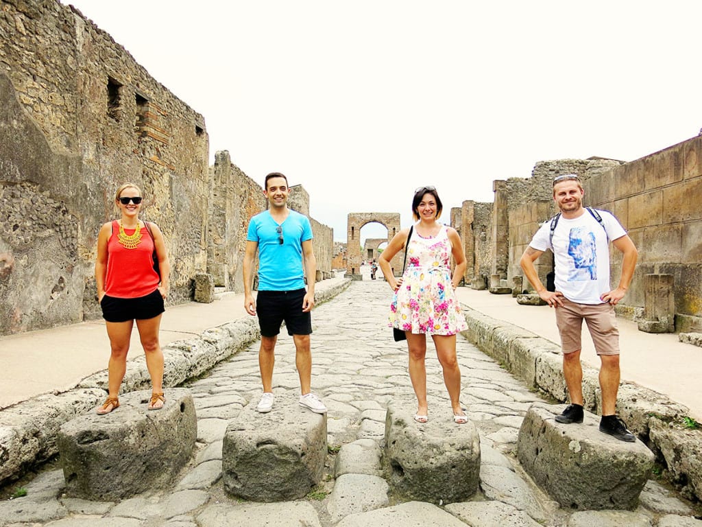 Pompei, Italy, people standing on the rocks middle of the street