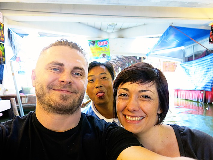 Just a smiling photo at Damnoen Saduak Floating Markets with our guide