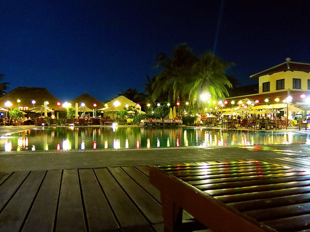 Night view of the Victoria Hoi An, Vietman, pool and lights of the restaurant