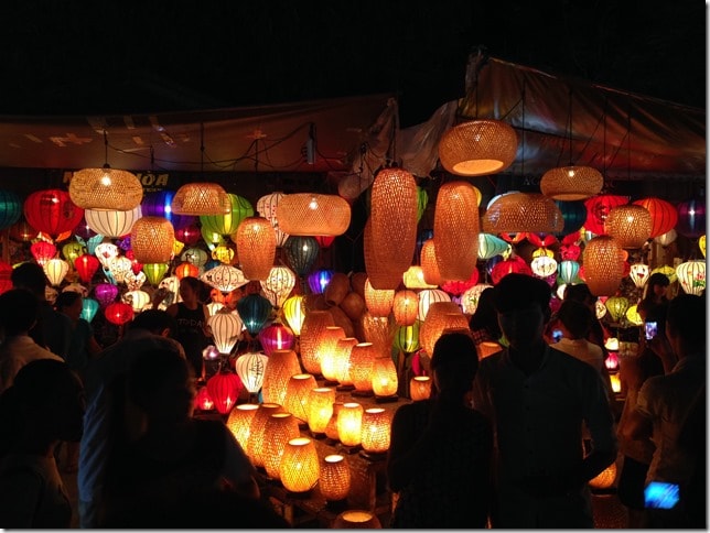 Hoi An Vietnam, lantern markets at night, people in the dark walking around and looking at the lanterns