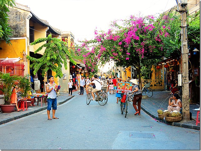 Streets of Hoi An Ancient Town - The City of Lanterns, Vietnam, street view, tourists and bicycles