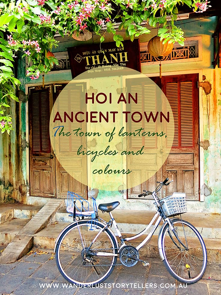 Hoi An Vietnam, bicycle with child seat in the back and basket in the front parked in front of an old building