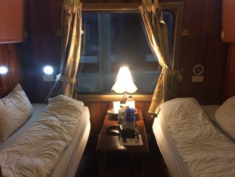 train from hanoi to sapa - Sapaly Express, view of the inside of the cabin, two beds, table with a light