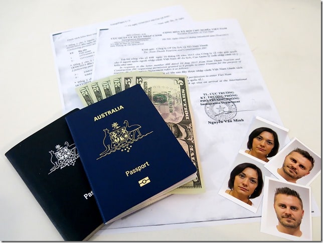 Travel Essentials - Vietnam Visa documents, US dollar notes 5 and 20s, Australian passports and passport photos of man and woman
