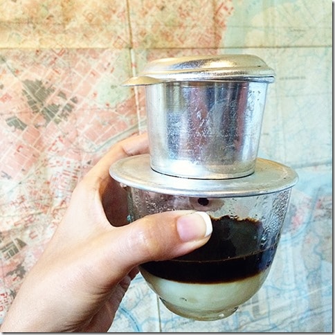 Vietnamese Coffee - Drip Coffee, woman's hand holding a cup 