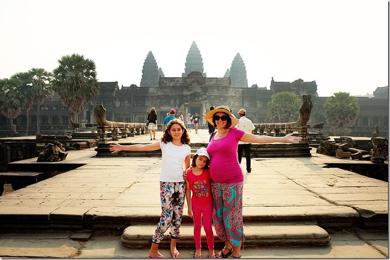 Travelling to Cambodia - Angkor Wat with Kids, mother and daughter posing in front of the temple