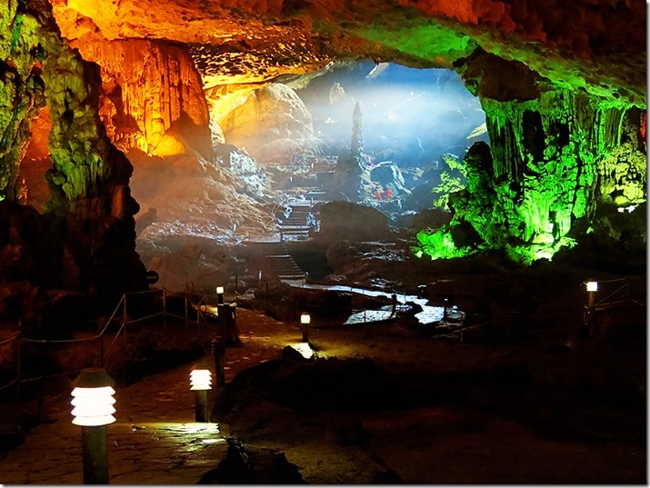 Cave in Halong Bay, Vietnam, colourful lights illuminating the walls and ceiling of the cave