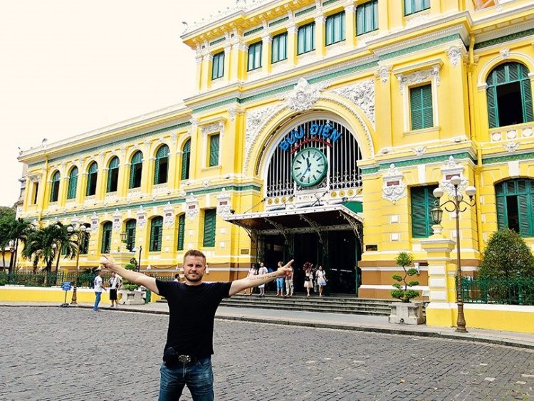 Best Time to Visit Saigon, man standing in front of the building, Vietnam