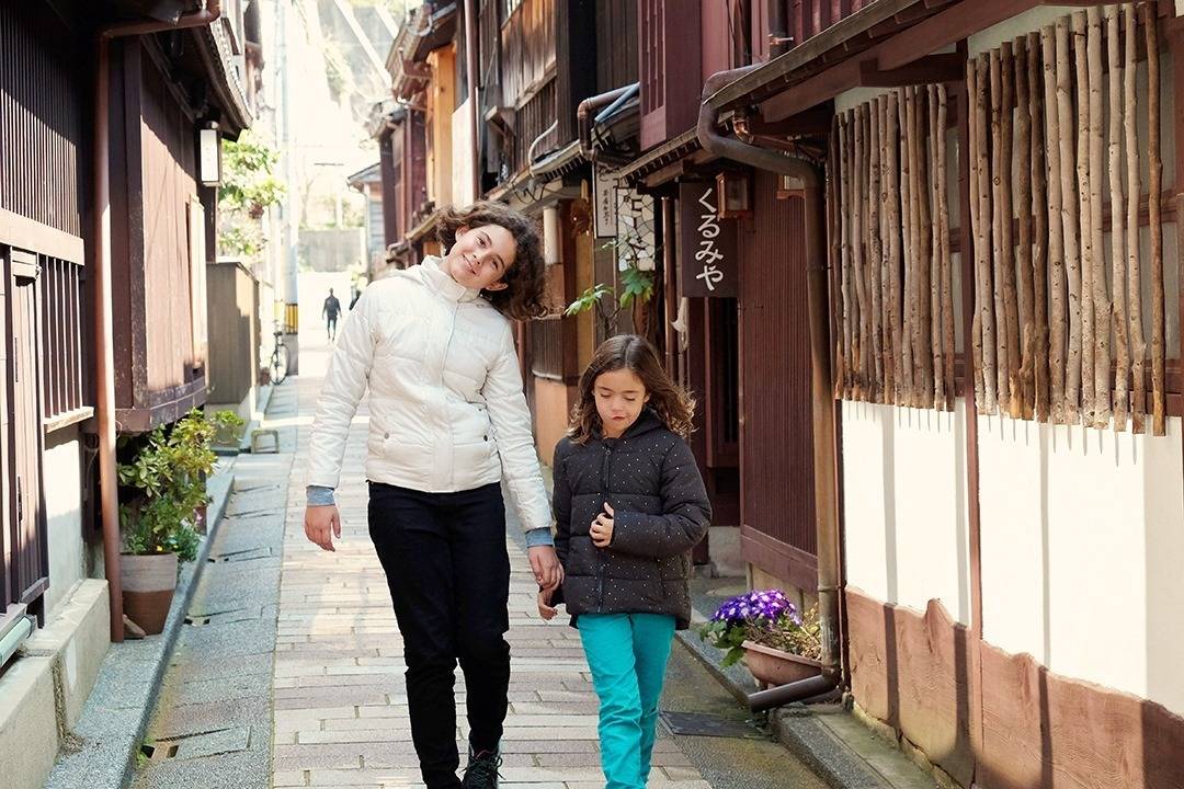 Higashi Chaya District Kanazawa, Japan, two girls walking in the narrow alley