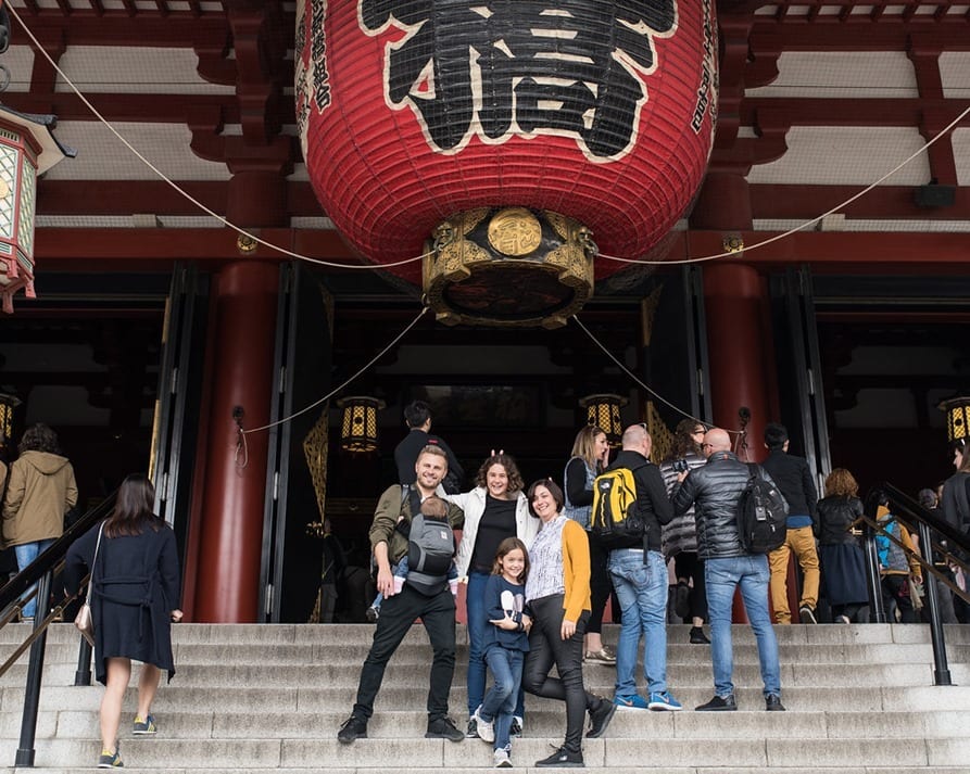 Senso-ji Temple Tokyo, family posing on the steps in front of the temple