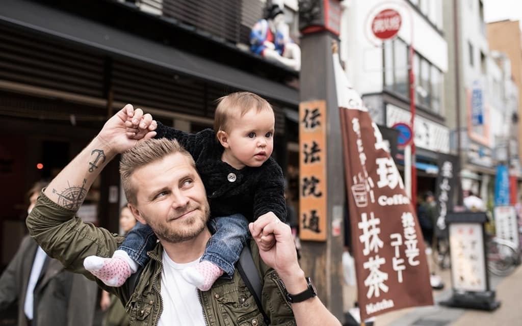 Kappabashi Kitchen Street, man holding a baby on his shoulders, smiling
