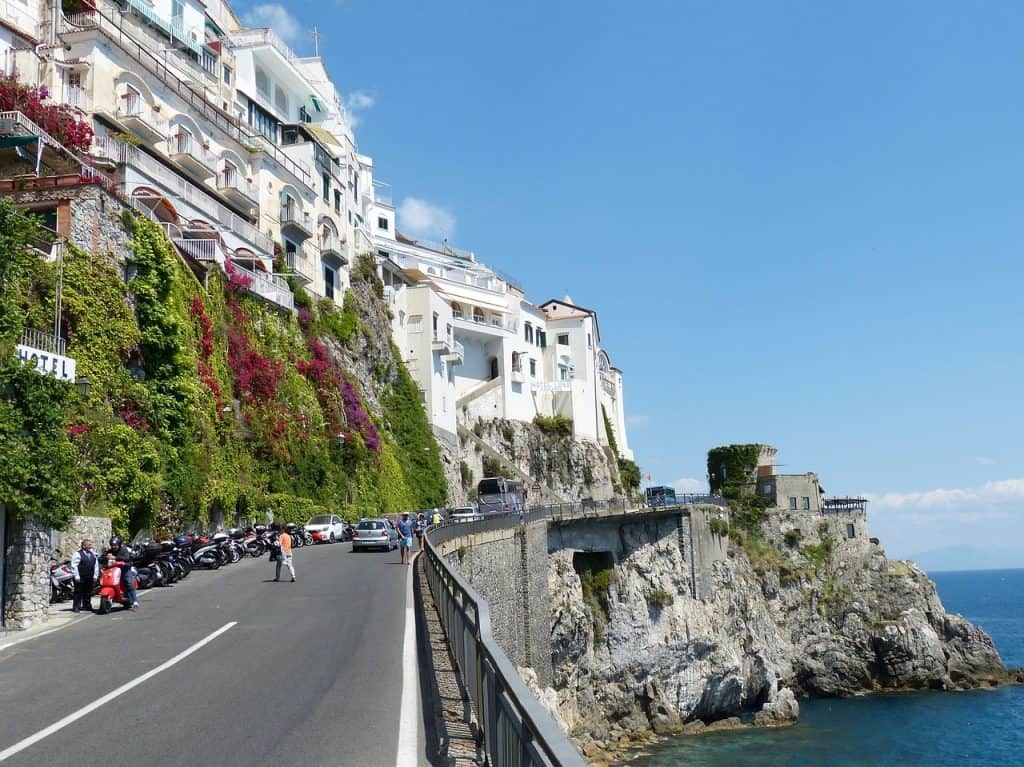 Street in Amalfi Coast, buildings, cars, some people, motorcycles