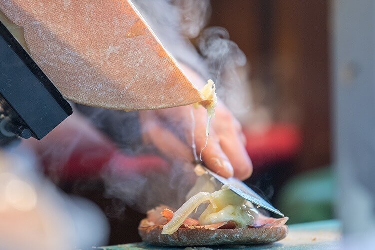 Traditional raclette swiss and french cheese