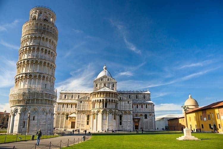 Tuscany Roadtrip with Kids, Leaning tower of Pisa and a church, yellow building and green grass