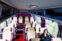 Inside the bus, bus seats and a woman sitting