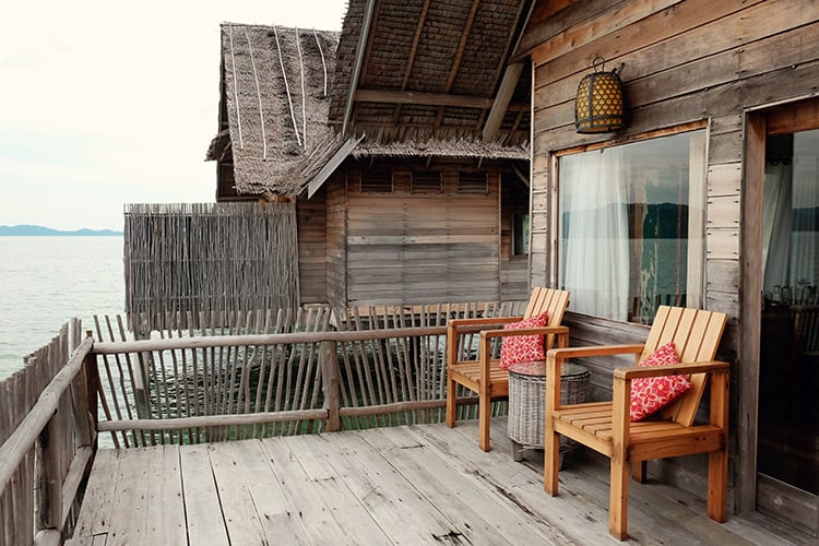 Telunas Private Island, Indonesia, view of the outdoor chairs on the balcony of the over water villa