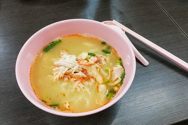Bowl of popular delicious Malaysia Ipoh sliced chicken noodle soup 