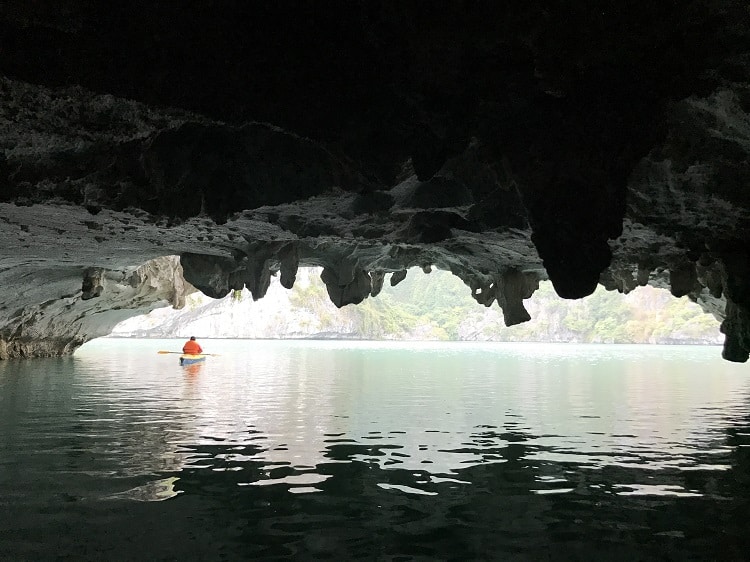 Dark and Bright Cave - Ha Long Bay Caves, Vietnam, one kayaker in the water