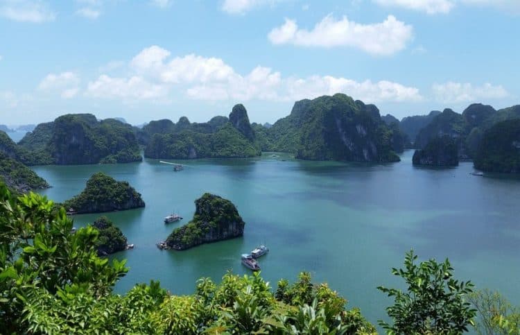 Halong Bay Vietnam, view from the top, boats and rocky mountain islands