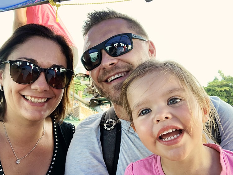 Enjoying the Speed Boat In Thailand, a couple with a toddler smiling