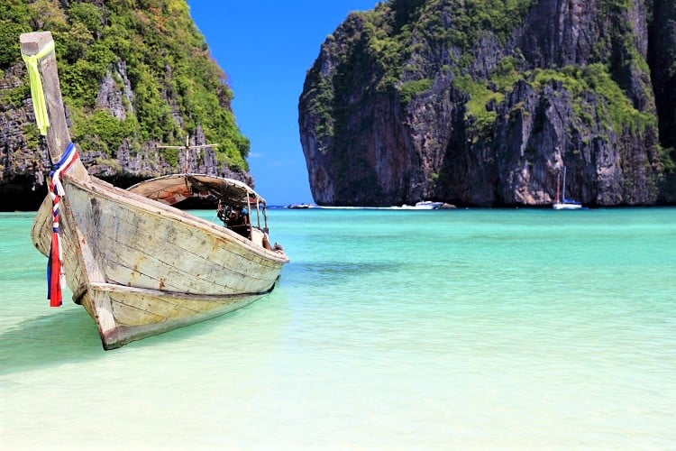 Phi Phi Island view from the beach, boat and rocky opening, Thailand