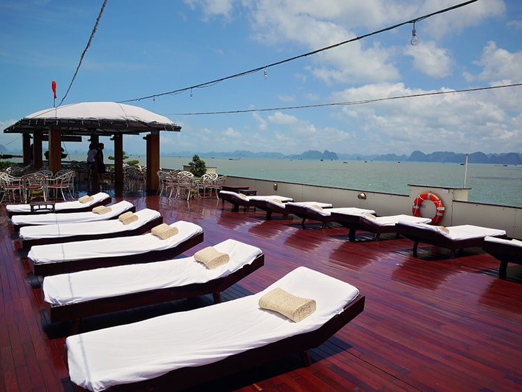 Emotion Halong Bay Cruise, top deck on the boat, white sun loungers, Halong Bay, Vietnam