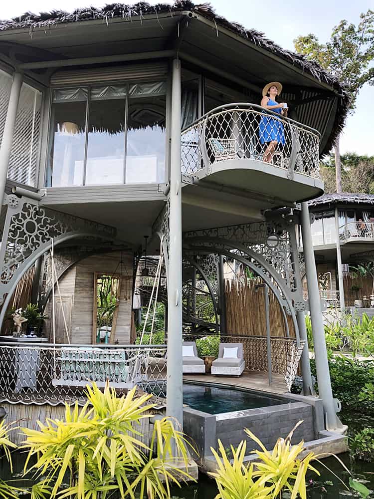 Treehouse Villa Koh Yao Noi, Thailand, woman in a blue dress standing on a balcony, plunge pool, swing seat