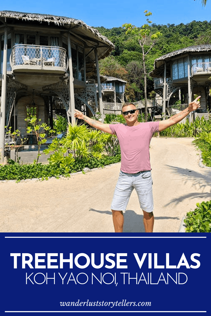 Review of Koh Yao Noi Treehouse Villas, man standing with arms out stretched in the sandy path between the villas