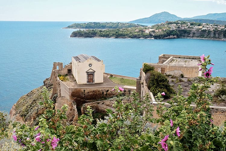 Santa Margherita Nuova, Procida Italy, building below, water and the bay in the back