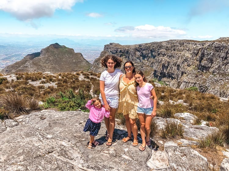 Table Top Mountain Cape Town with Kids, Mother and three daughters on the top of the mountains, smiling 