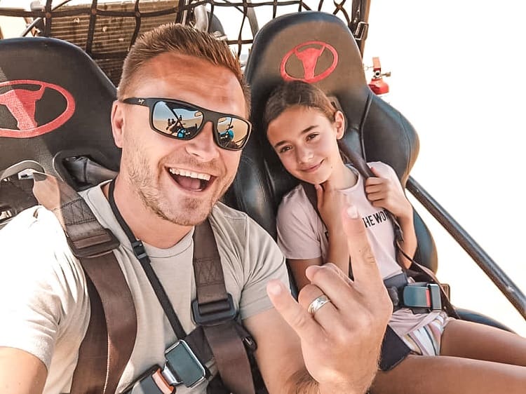 What to do for fun in Swakopmund with Kids, father and daughter in the seats of the sand buggy, smiling