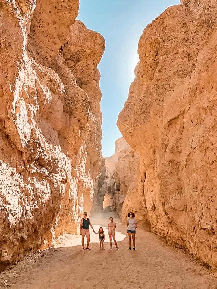 Sesriem Canyon in Sossusvlei Namibia, mother and three daughters standing for the photo on the floor of the canyon