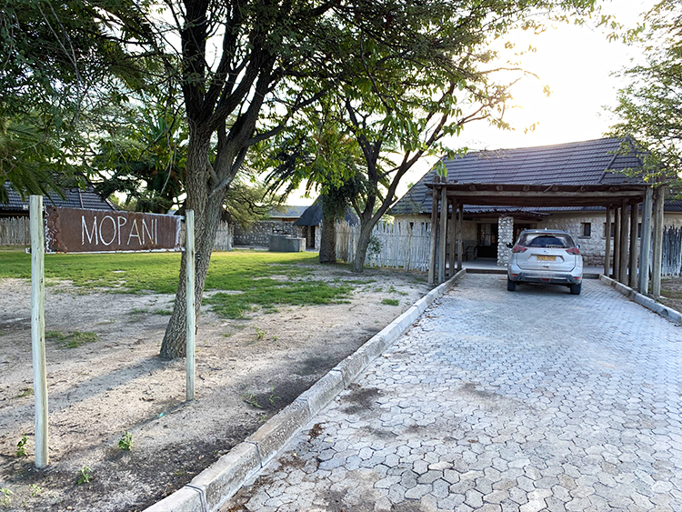 Accommodation in Etosha National Park - driveway, house and car