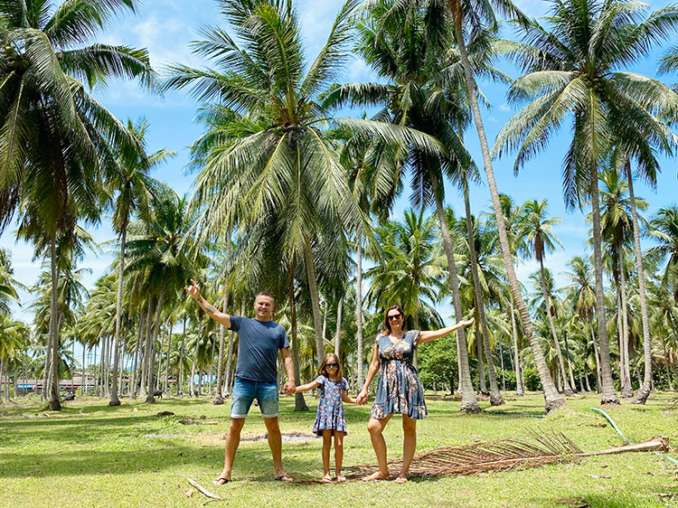 Family in the palm tree forest, Koh Samui, Thailand