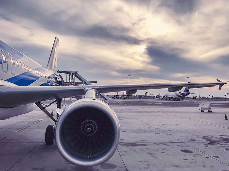 Bangkok Airways, plane at the airport, airplane wing with the engine 