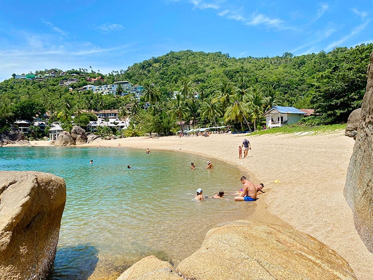Coral Cove, Koh Samui, Thailand, people sitting in the water, palm trees