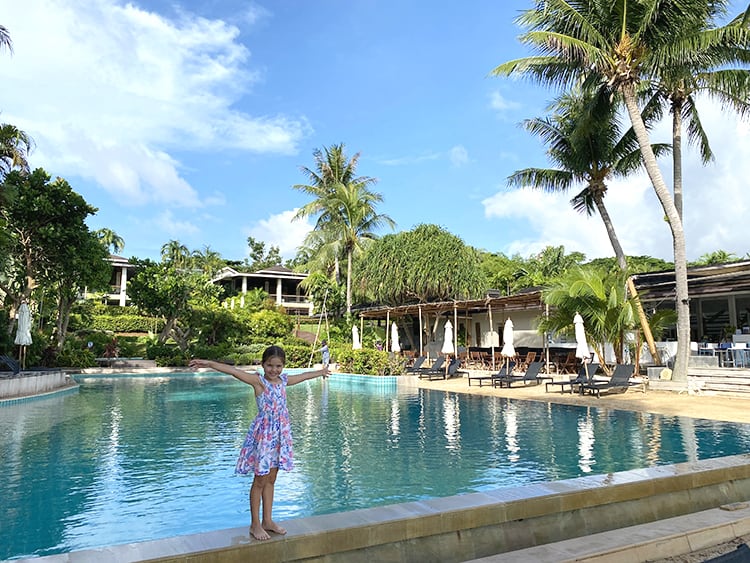 The Village Coconut Island Resort Review - young girl by the pool