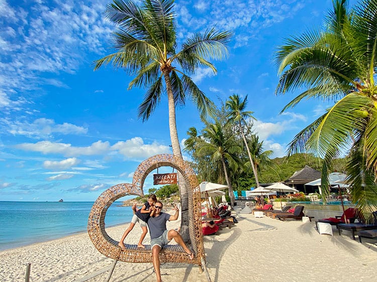 Thongson Bay Beach, Koh Samui, Thailand, palm trees, heart shaped photo seat, father and daughter posing