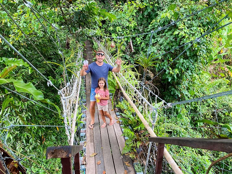 Tree Bridge Cafe, Koh Samui, Thailand, father and daughter posing on the rope bridge, holding drinks