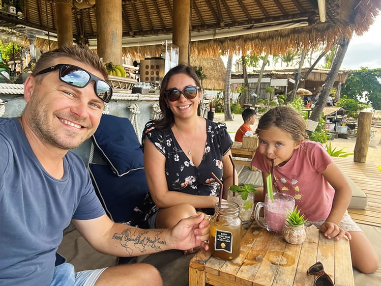 Family with a daughter sitting at the beach side restaurant at Best Restaurants in Koh Samui - Beach Views at Coco Tams Fisherman's Village Koh Samui