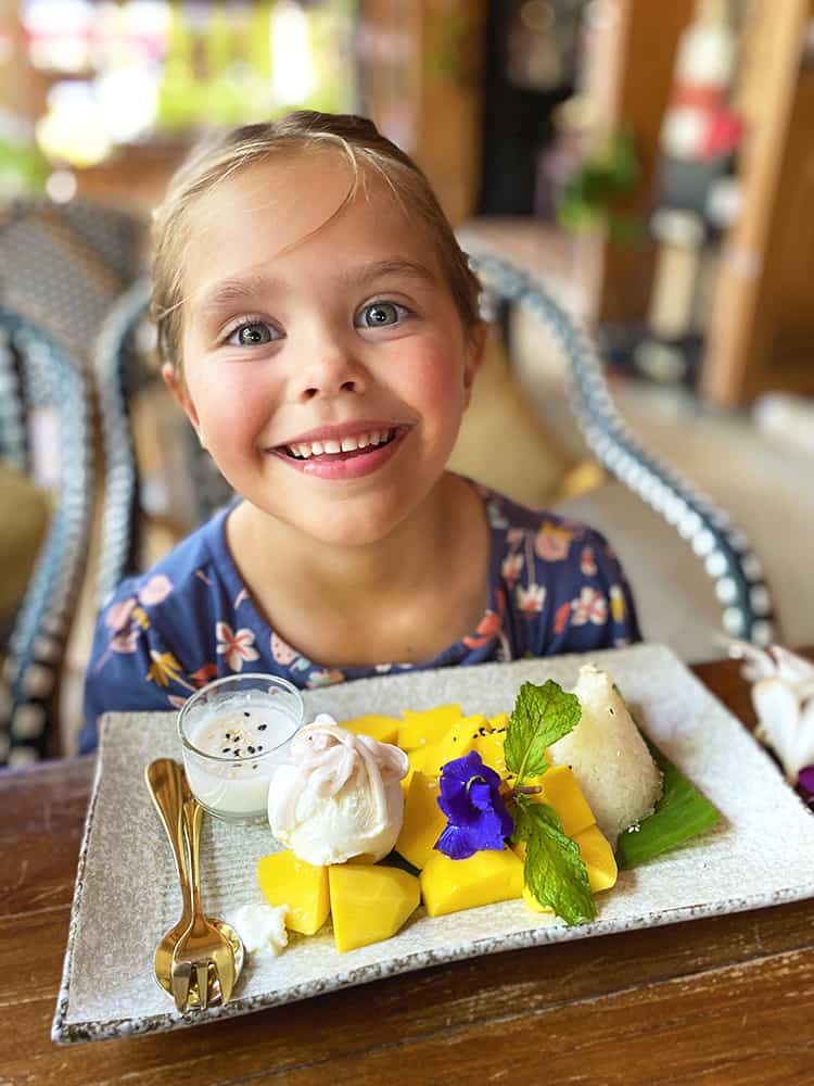 Best Thai Restaurants in Koh Samui - Girl eating Mango Sticky Rice at the Phensiri Koh Samui