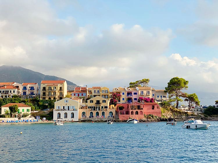 Assos,  Kefalonia, Greece, Things to do in Kefalonia, colourful houses on the water's edge, boats, mountain