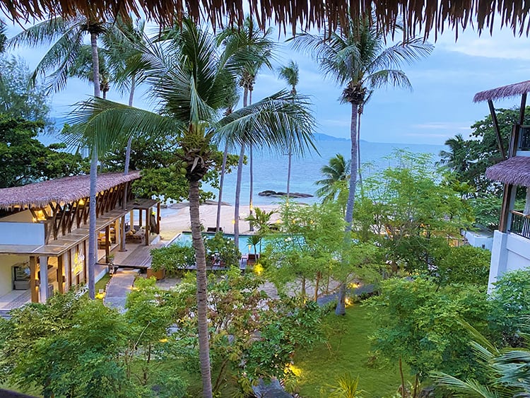 Accommodation in Koh Phangan, view from the balcony, pool, restaurant palm trees and water
