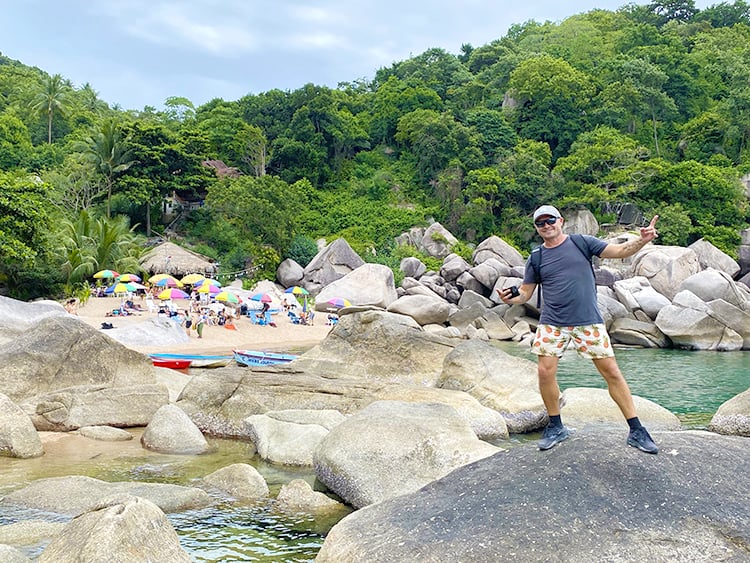 Best Beaches in Koh Tao, Thailand - Hin Wong Bay Koh Tao, man standing on a rock