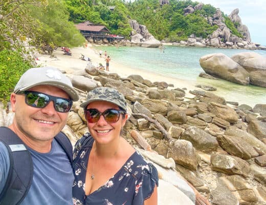 Best Beaches in Koh Tao Thailand - Freedom Beach, couple at the rocks, beach in background