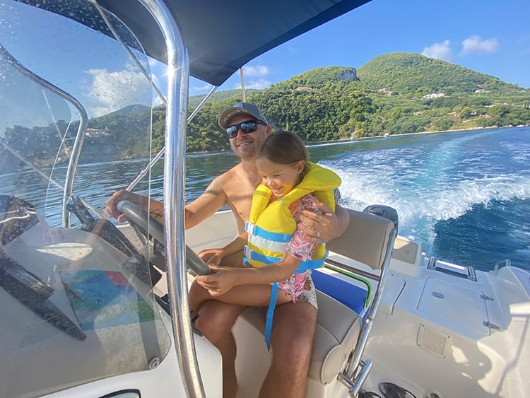 Things to do in Zakynthos - Fun at Sea Boat hire, father and daughter on the motor boat