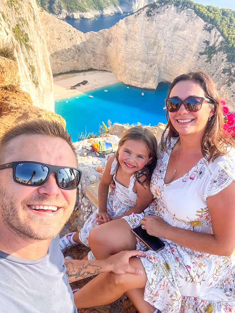 Things to do in Zakynthos - Shipwreck Beach View Point, family at the lookout Navagio Beach Greece