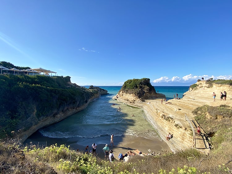 Canal d'Amour in Corfu, Greece, view from the top of the canal, people on the beach and rocks